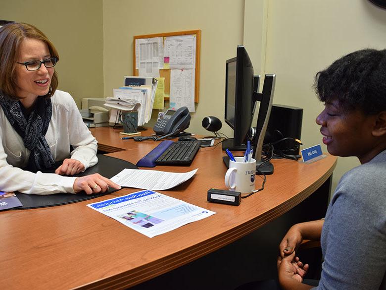 student with financial aid officer